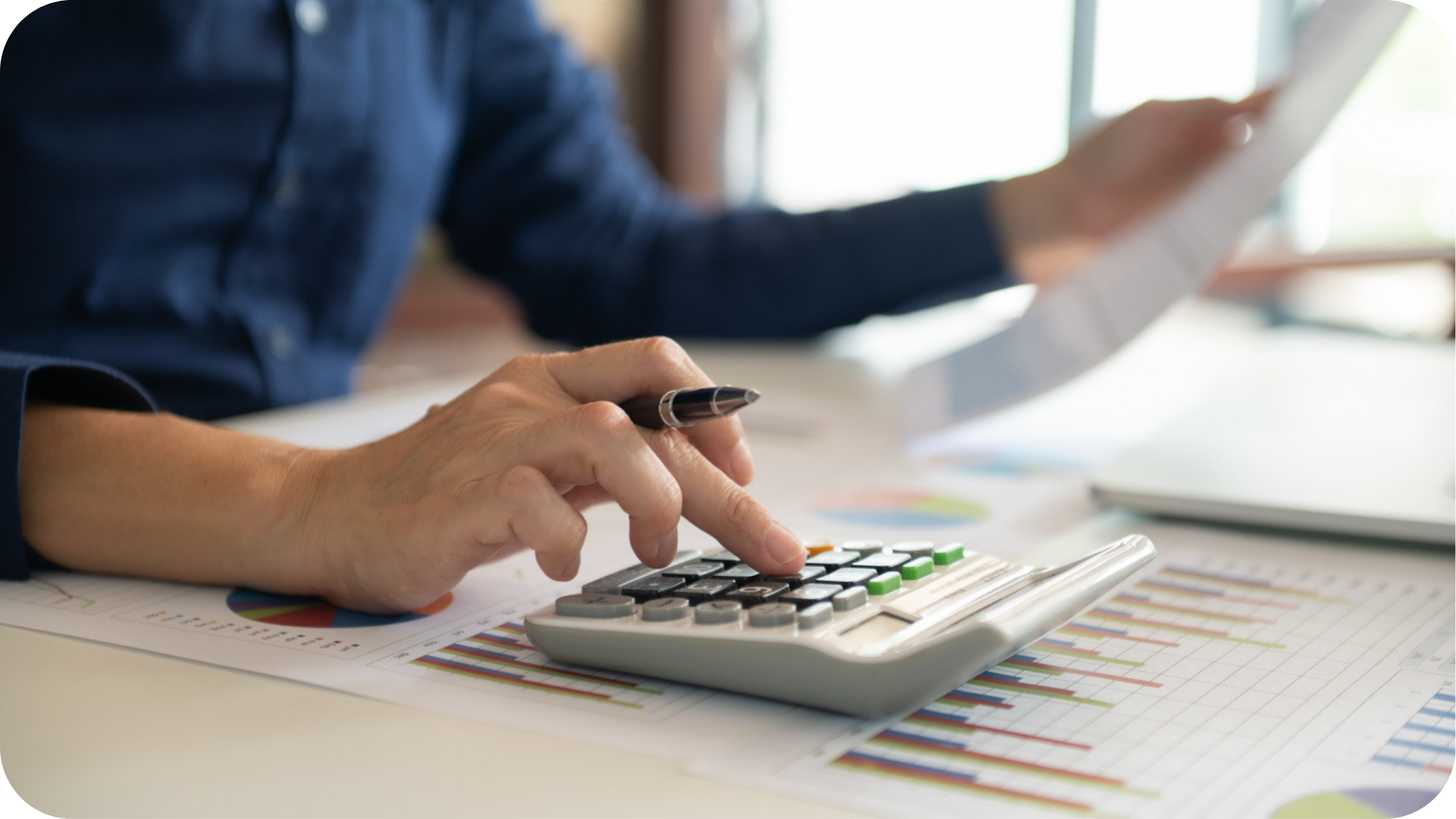 Cash Flow Forecast for Startup Business shown by an accontant using a calculator