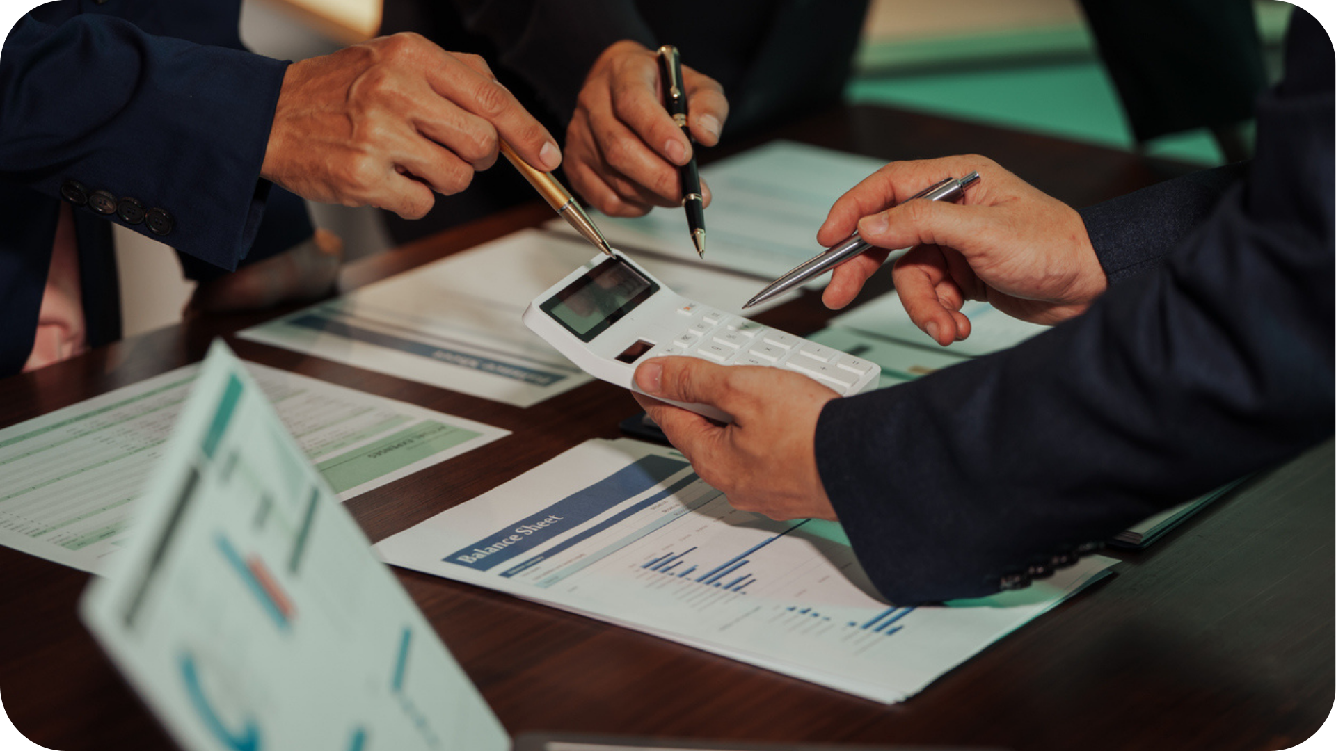 Cash Flow Forecast for Startup Business shown by professionals working out finances on a calculator